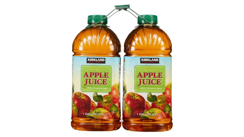 Apple juice bottles on white background