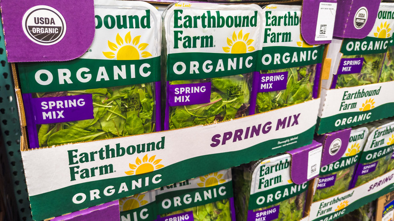 Packages of organic spring mix on display in Costco