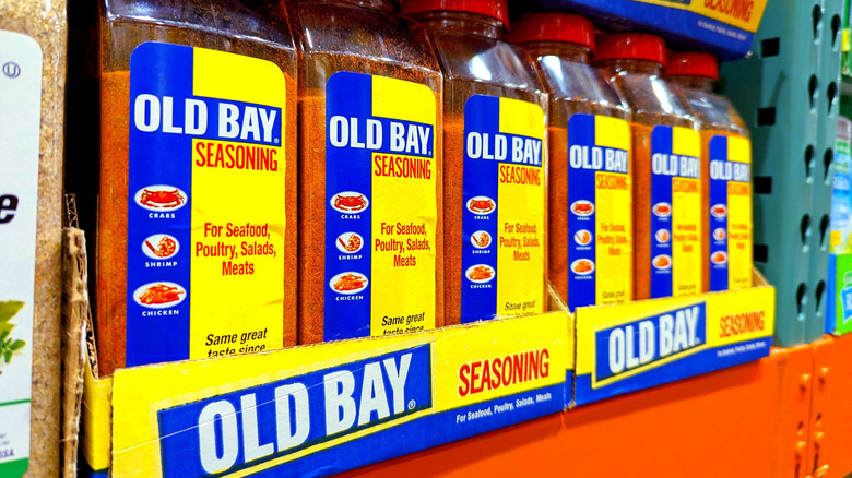 Containers of Old Bay seasoning on a store shelf