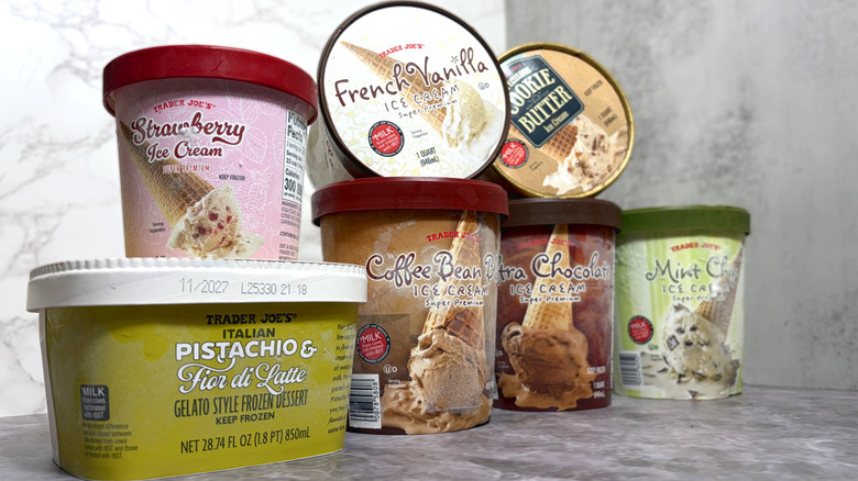 Stacked containers of different varieties of Trader Joe's ice cream