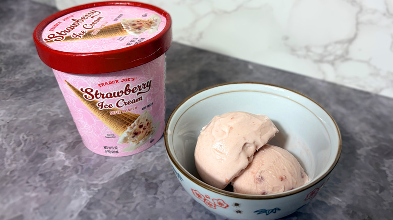 Package and bowl of strawberry ice cream