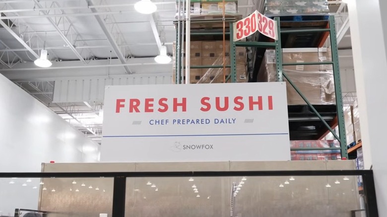 A sign inside Costco that says "Fresh Sushi, Chef Prepared Daily"