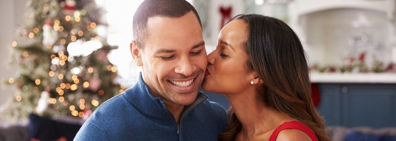 Kissing Christmas couple