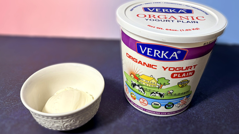 A tub of Verka organic yogurt and a scoop in bowl