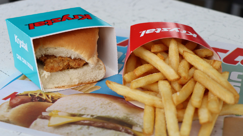 A chicken slider and fries from Krystal on a table