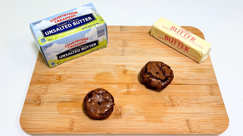 A box of Countryside Creamery Sweet Cream Unsalted Butter next to a stick of butter and two brownie bites