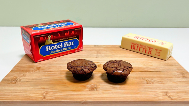 A box of Hotel Bar Unsalted Butter next to a stick of butter and two brownie bites