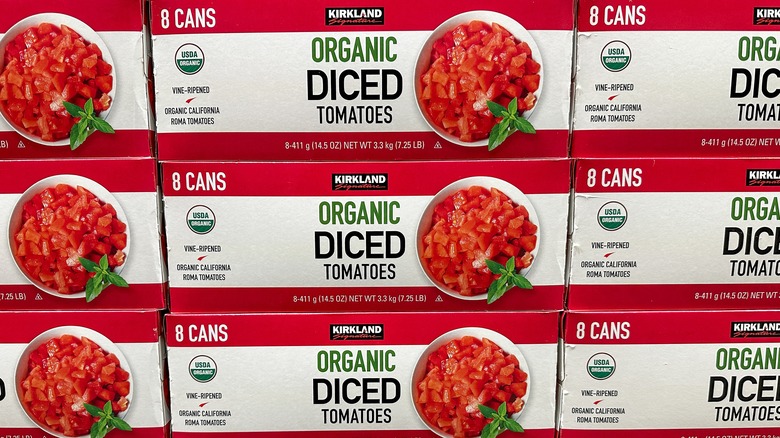 stacked packages of kirkland diced tomato cans