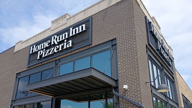 The brick exterior of Home Run Inn Pizza