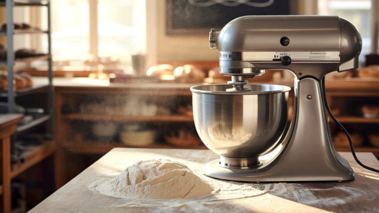 A silver stand mixer inside a bakery