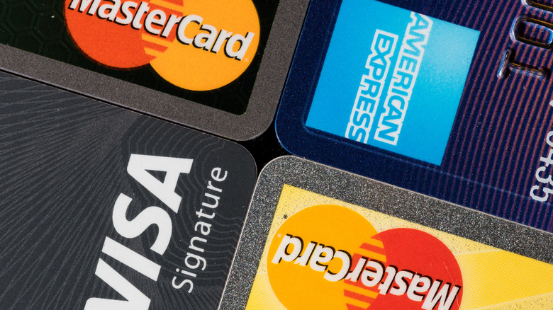 A close-up of Mastercard, Visa, and American Express credit cards