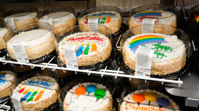 Costco birthday cakes arranged on wire racks
