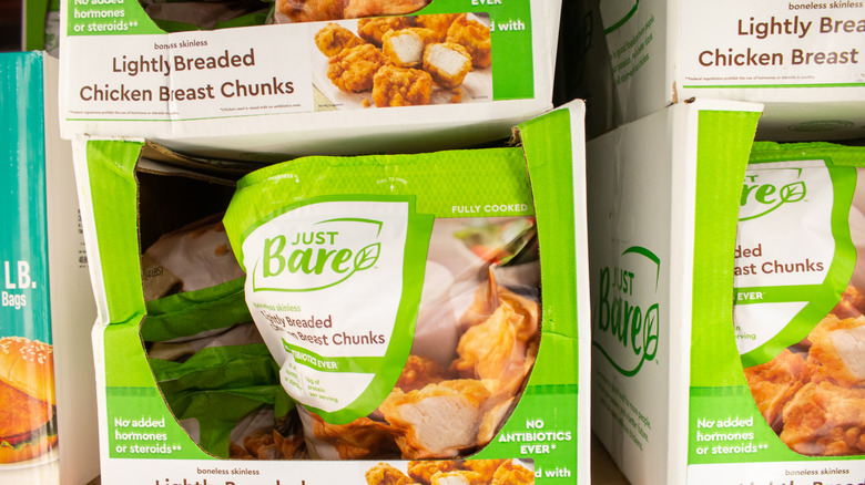 Packages of Just Bare chicken chunks in boxes on a shelf