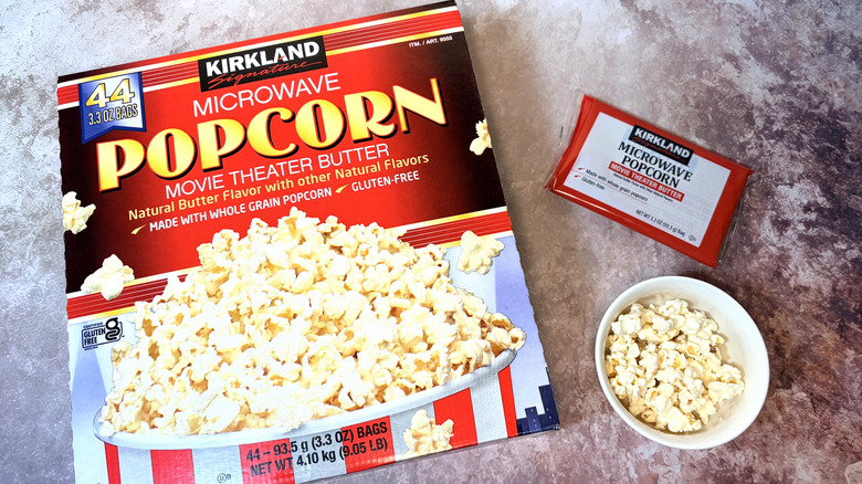 box of Kirkland microwave popcorn and popped corn in a bowl