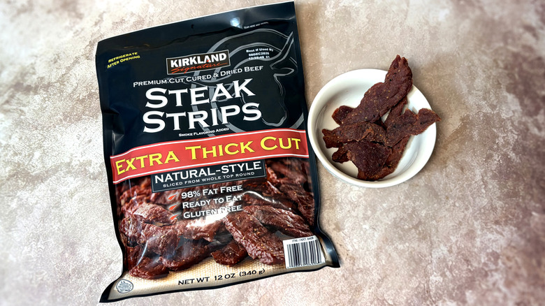 package and bowl of Kirkland extra thick cut steak strips