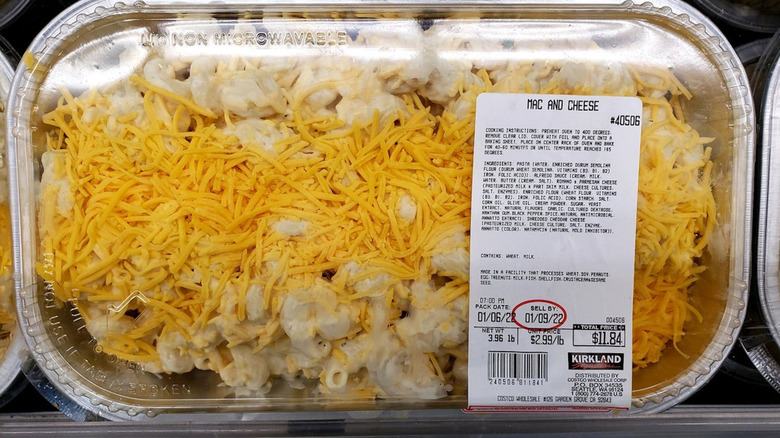 Aluminum tray with uncooked Kirkland Signature mac and cheese
