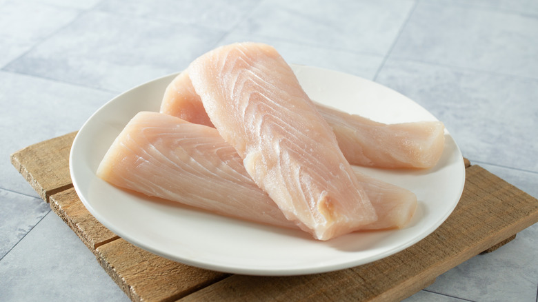 Raw mahi-mahi fillets on a plate