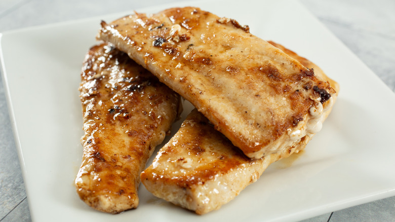 A pile of cooked mahi-mahi fillets