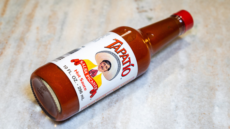 Bottle of hot sauce on counter