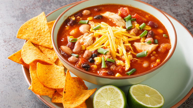 Tortilla chips on the side of chicken tortilla soup