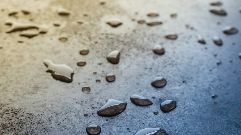 Beads of water on a griddle