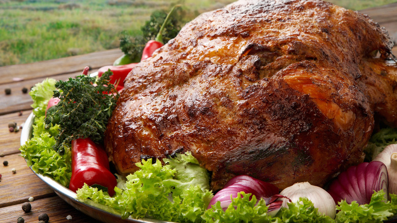 Roasted pork shoulder with vegetable garnish