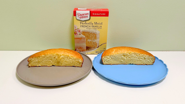 A box of Duncan Hines Perfectly Moist French Vanilla Cake Mix next to two plates of cake
