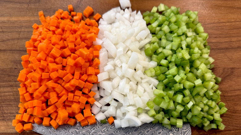 Diced carrots, celery, and onions on cutting board