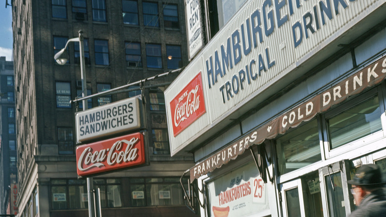 Awning of store advertising hamburgers and sandwiches in the 1960s