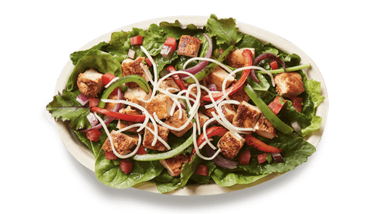 Chipotle salad on white background