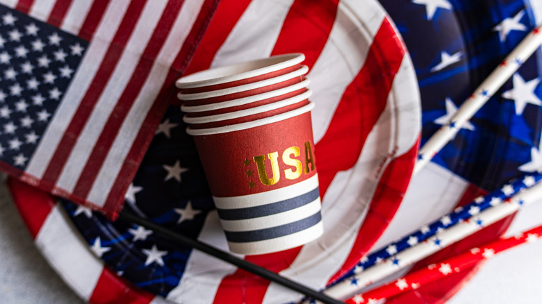 Stack of USA-themed paper cups with American flag-themed paper plates