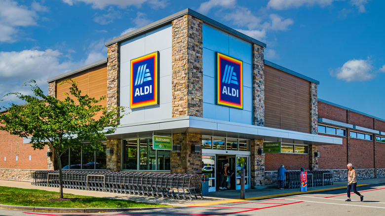 Aldi storefront against a vibrant blue sky