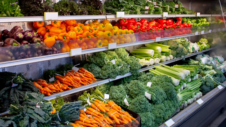 Grocery store produce department with vibrant fresh vegetables