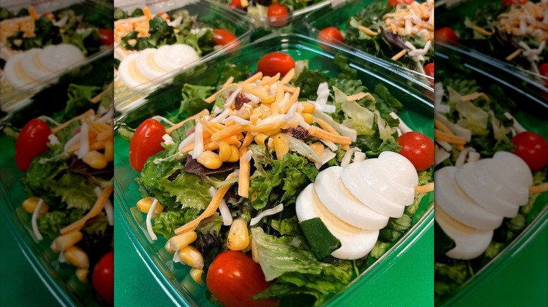 Salad with tomato, corn, cheese, boiled egg