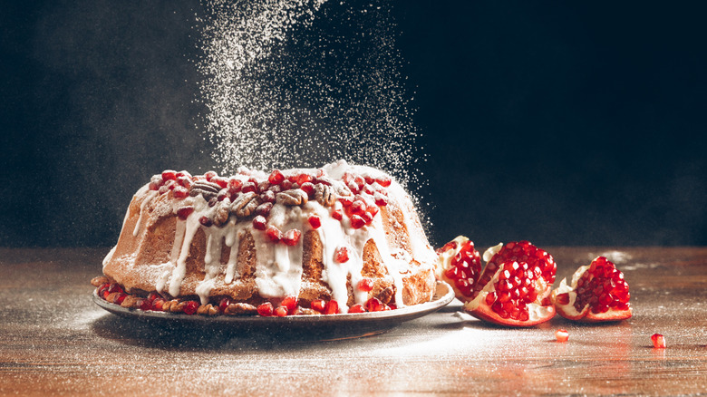 Powdered sugar falling onto Christmas fruit cake