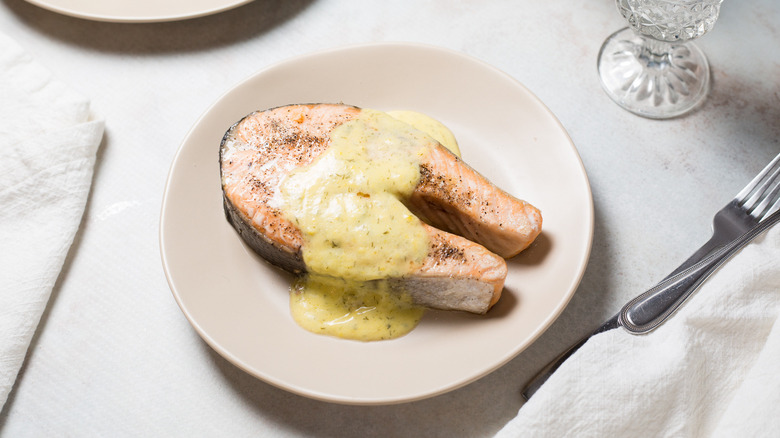 salmon steak served on table