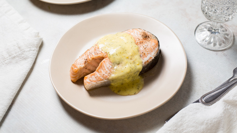 salmon steak served on table