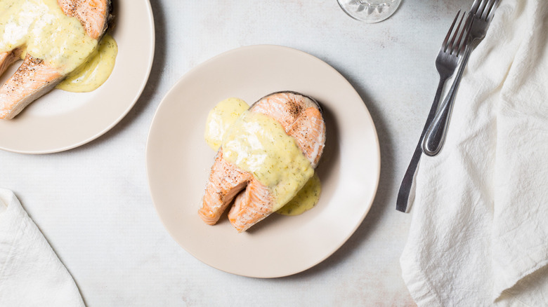 salmon steaks served on table