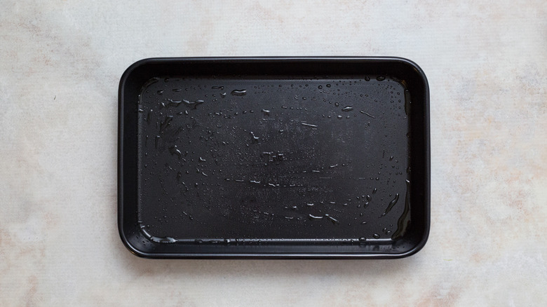 greased baking dish on table