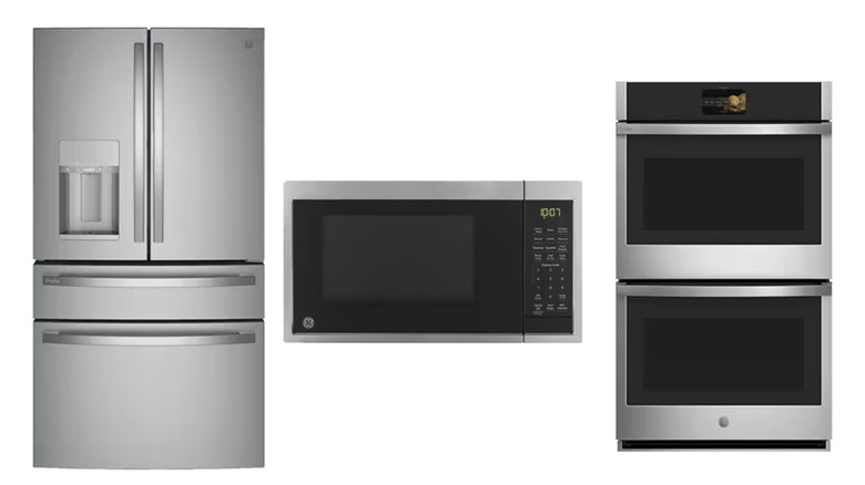 A GE Profile refrigerator, microwave, and dual wall oven, finished in stainless steel