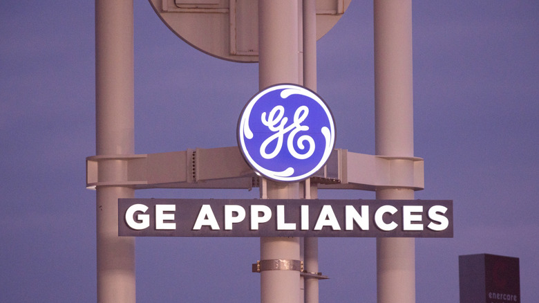A large GE Appliances logo mounted on a gray tower