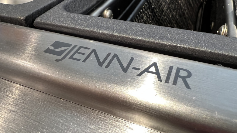 A close-up of the Jenn-Air logo on an appliance