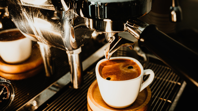 Espresso machine pouring coffee