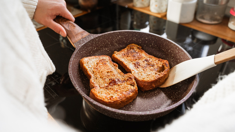French toast being cooked in nonstick pan