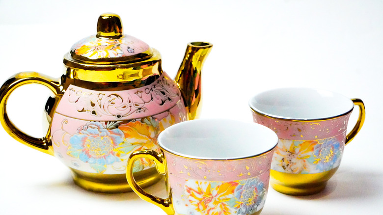 Vintage tea kettle and teacups