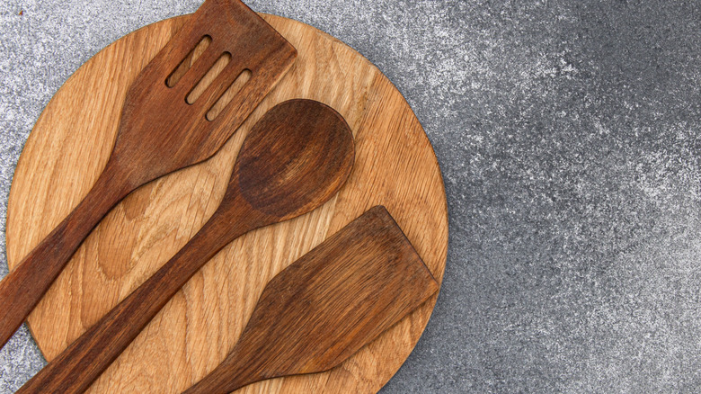 Serving utensils on wooden board