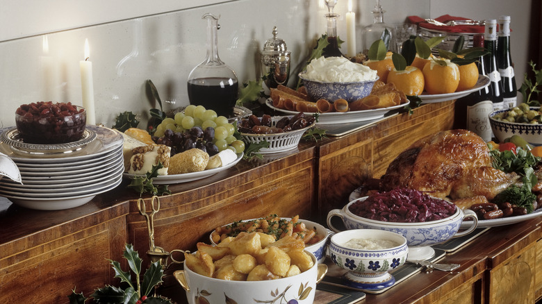 A vintage buffet table with a full buffet spread on top