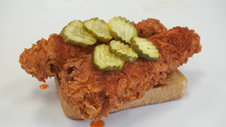 Nashville hot chicken and pickles on bread