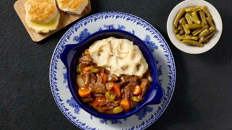 Cracker Barrel slow-braised pot roast with biscuits, green beans, and mashed potatoes
