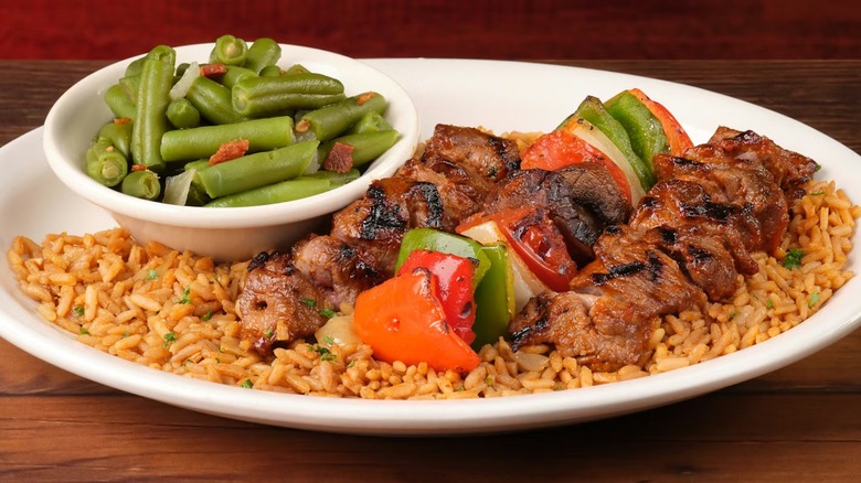 Texas Roadhouse steak kabobs with seasoned rice and green beans